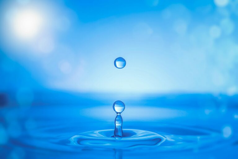 Water drop splash on water surface